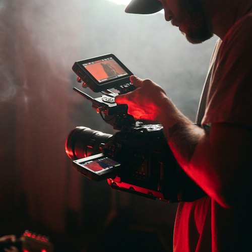 Camera operator reviewing footage